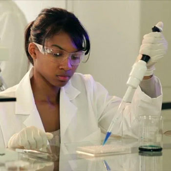 lab technician using pipette