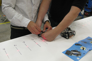 Two human factors interns collaboratively building a Lego set